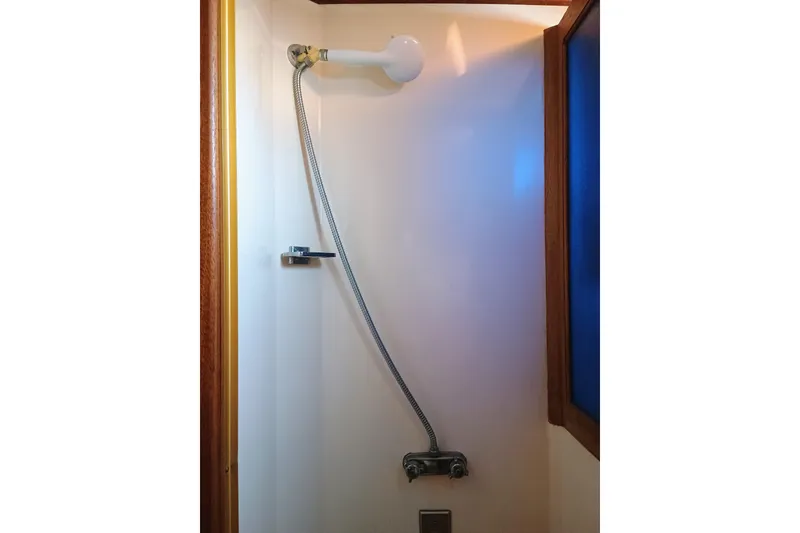 Slide: The Image of 1978 Californian LRC shower with flexible hose and wooden trim. - 23