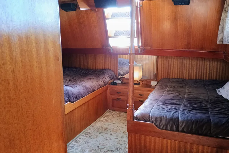 Slide: The Image of 1978 Californian LRC cabin interior with twin beds and wooden furnishings. - 28