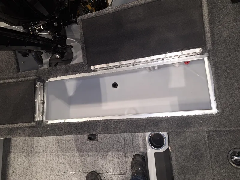 Slide: The Image of Open storage compartment in 2025 Starcraft Delta 188 T boat interior. - 10