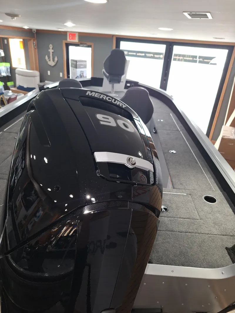 Slide: The Image of 2025 Starcraft Delta 188 T boat with Mercury 90 engine in showroom. - 13