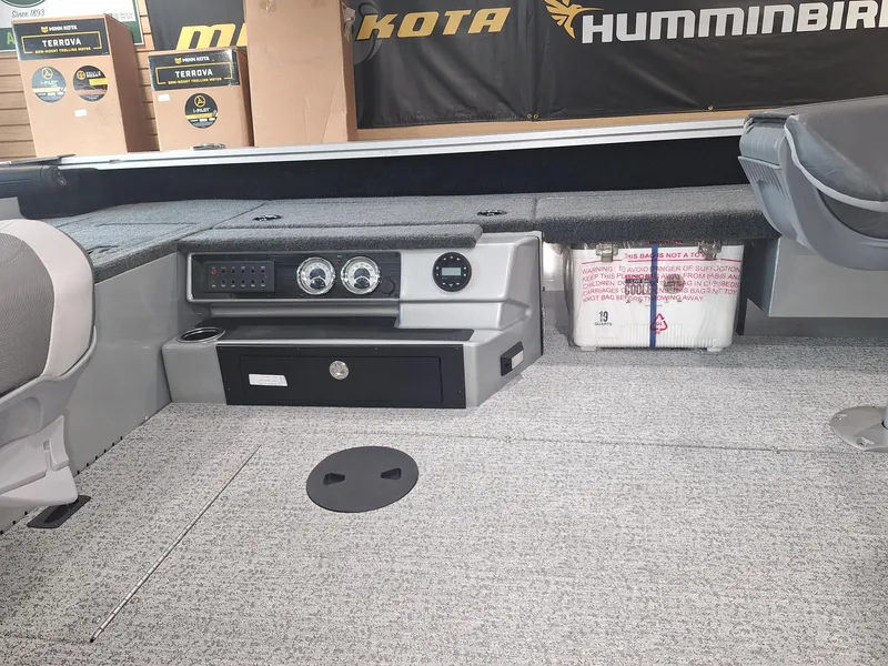 Slide: The Image of 2025 Starcraft Delta 188 T boat interior with control panel and seating area. - 15