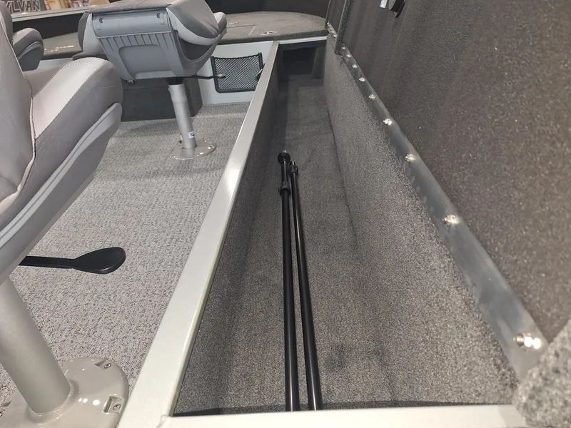 Slide: The Image of 2025 Starcraft Delta 188 T boat interior with seating and storage compartment. - 17