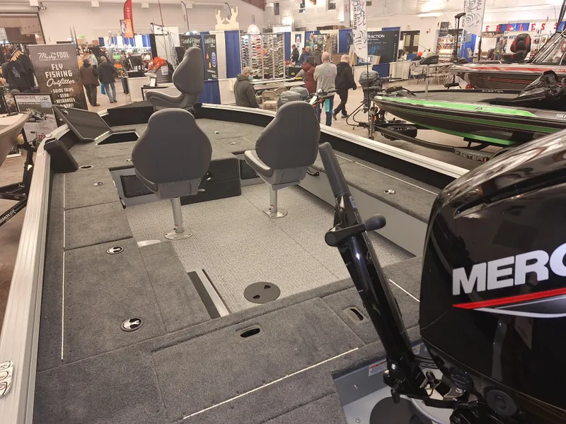 Slide: The Image of 2025 Starcraft Delta 188 T boat interior with Mercury engine at a boat show. - 3