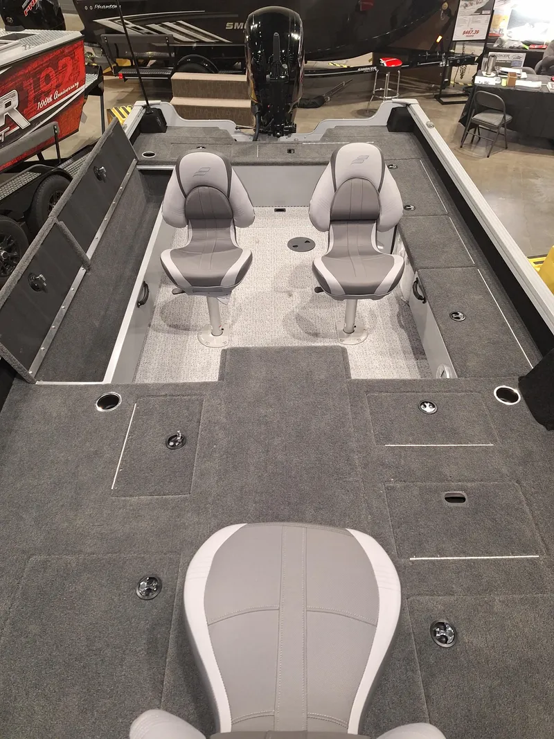 Slide: The Image of 2025 Starcraft Delta 188 T boat interior with dual seats and spacious deck layout. - 8