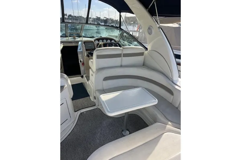 Slide: The Image of 2005 Searay 320 boat interior with seating and helm, featuring modern design and comfort. - 6