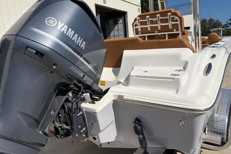 Slide: The Image of 2025 Key West 239 FS boat with Yamaha outboard motor, docked outdoors. - 12