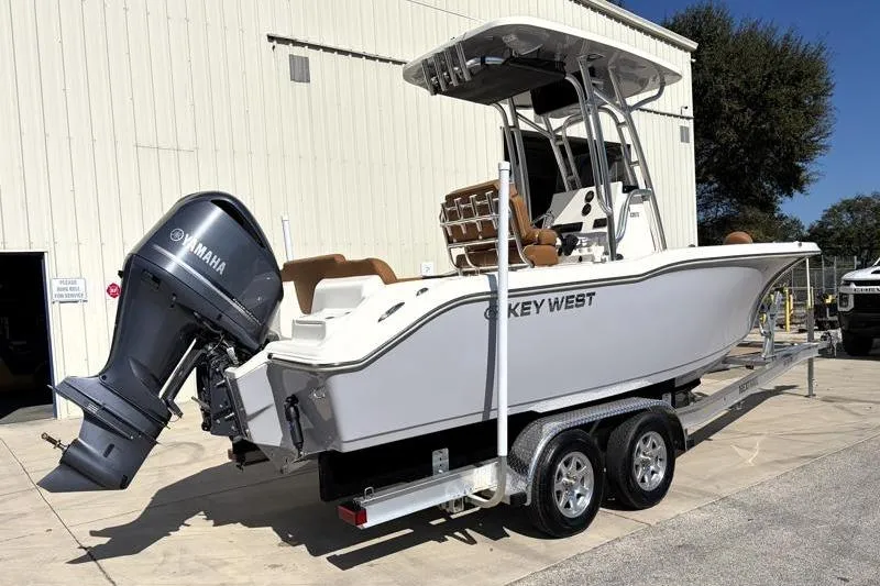 Slide: The Image of 2025 Key West 239 FS boat on trailer with Yamaha outboard motor. - 2