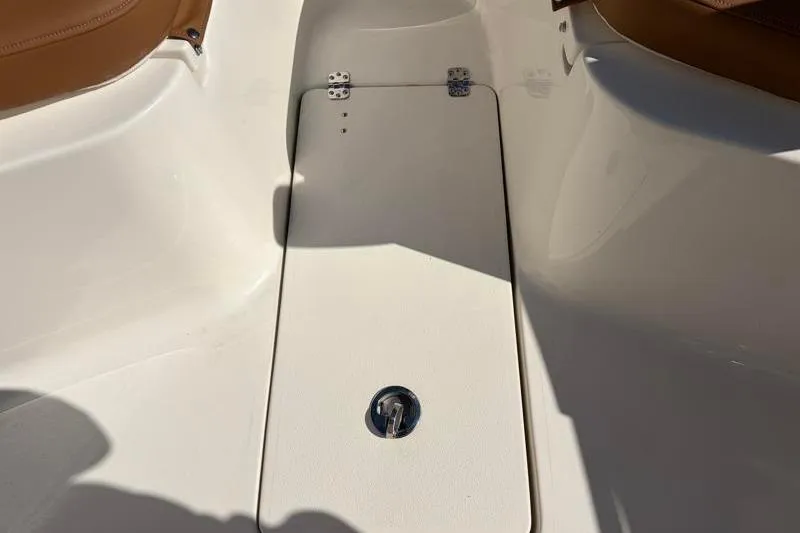 Slide: The Image of 2025 Key West 239 FS boat interior with storage compartment and seating. - 20