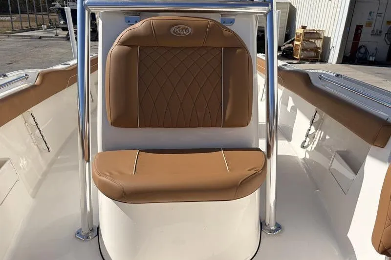 Slide: The Image of 2025 Key West 239 FS boat with tan cushioned seating and stainless steel railings. - 21