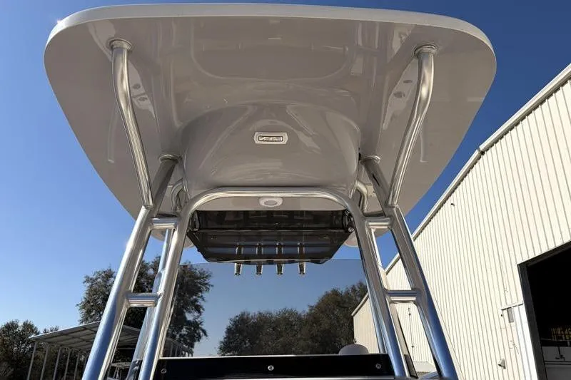Slide: The Image of 2025 Key West 239 FS boat T-top with rod holders, under clear blue sky. - 22