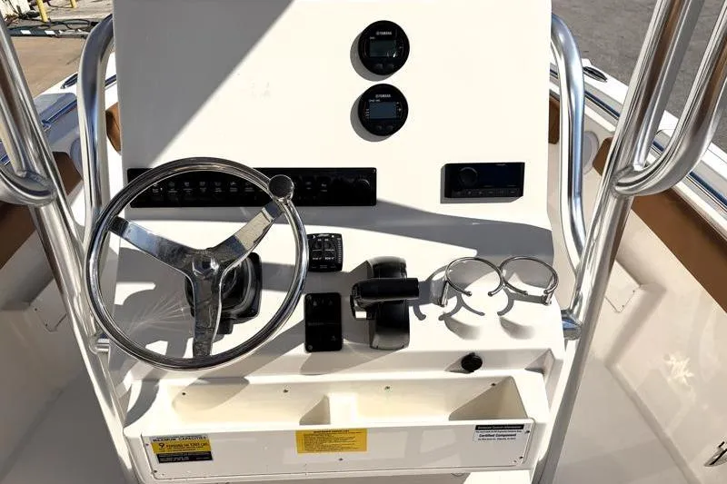 Slide: The Image of 2025 Key West 239 FS boat console with steering wheel and controls. - 27
