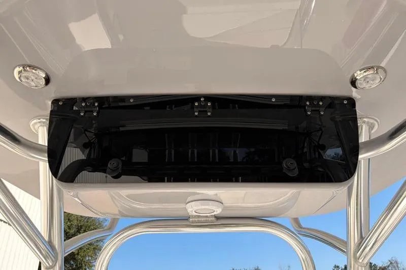 Slide: The Image of 2025 Key West 239 FS boat T-top with integrated lighting and storage compartment. - 32