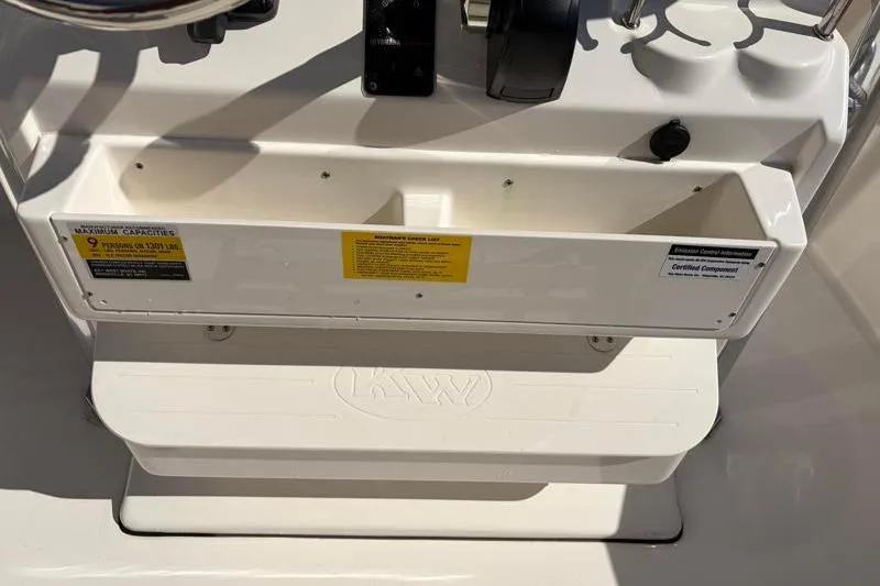 Slide: The Image of 2025 Key West 239 FS boat console with storage compartment and capacity label. - 33
