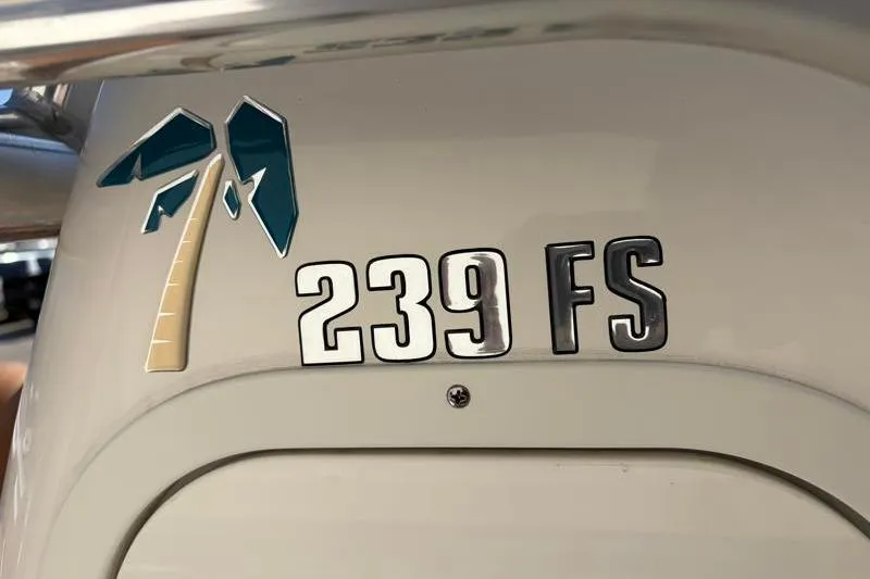 Slide: The Image of 2025 Key West 239 FS boat logo with palm tree design. - 35