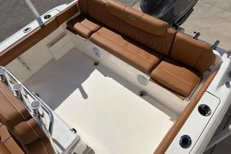 Slide: The Image of 2025 Key West 239 FS boat interior with tan seating and white deck. - 36