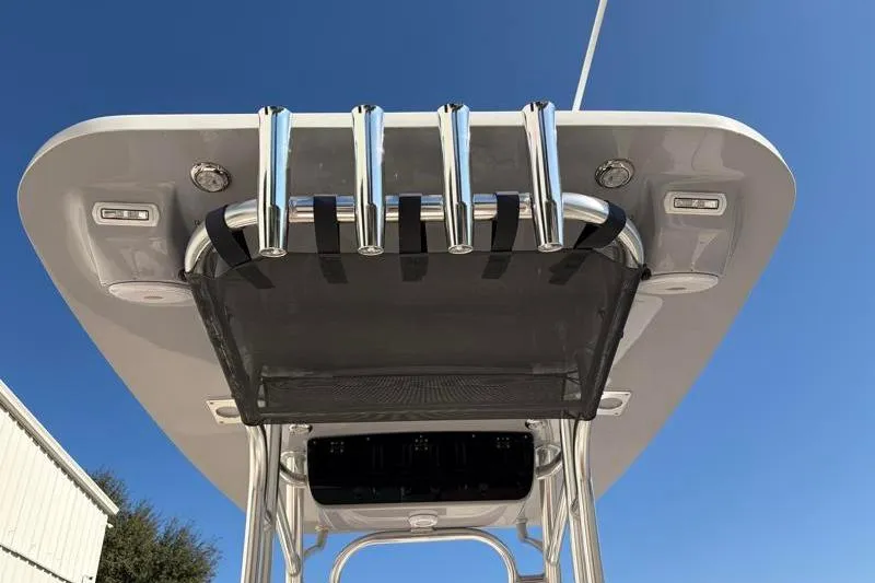 Slide: The Image of 2025 Key West 239 FS boat T-top with rod holders against clear blue sky. - 39