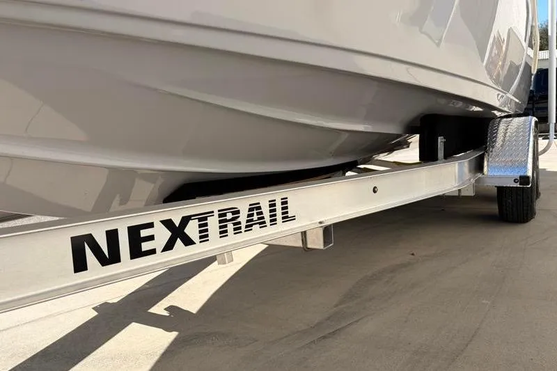 Slide: The Image of 2025 Key West 239 FS boat on NexTrail trailer, close-up view. - 47