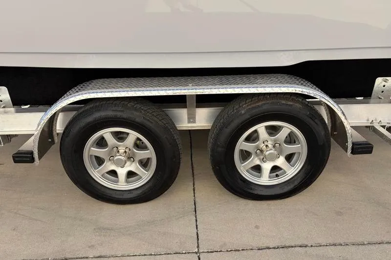 Slide: The Image of Dual axle trailer with silver rims for 2025 Key West 239 FS boat. - 48