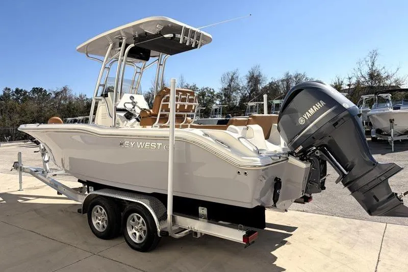 Slide: The Image of 2025 Key West 239 FS boat on trailer with Yamaha outboard motor. - 5