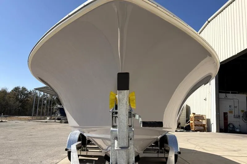 Slide: The Image of 2025 Key West 239 FS boat on trailer outside a warehouse. - 7