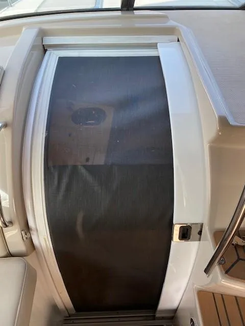 Slide: The Image of 2012 Formula 350 Sun Sport cabin door with screen, showcasing sleek design and functionality. - 10