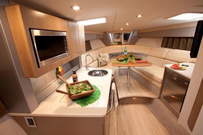 Slide: The Image of Interior of 2012 Formula 350 Sun Sport yacht with modern kitchen and dining area. - 11