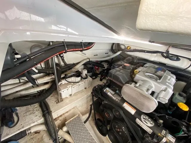 Slide: The Image of Engine compartment of a 2012 Formula 350 Sun Sport boat, showcasing mechanical components and wiring. - 31