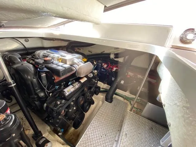 Slide: The Image of Engine compartment of a 2012 Formula 350 Sun Sport boat, showcasing mechanical components. - 32