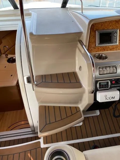 Slide: The Image of 2012 Formula 350 Sun Sport boat interior with steps and control panel. - 9