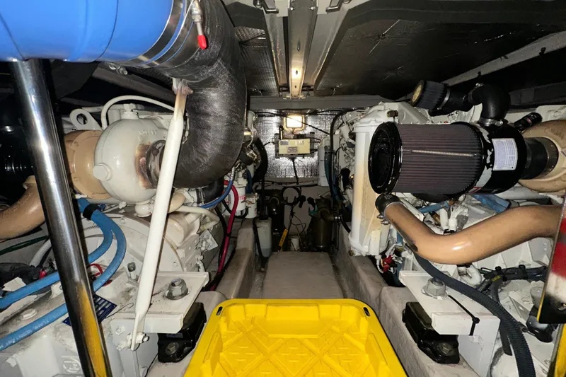 Slide: The Image of Engine room of 2005 Sea Ray 420 Sedan Bridge with visible components and wiring. - 14