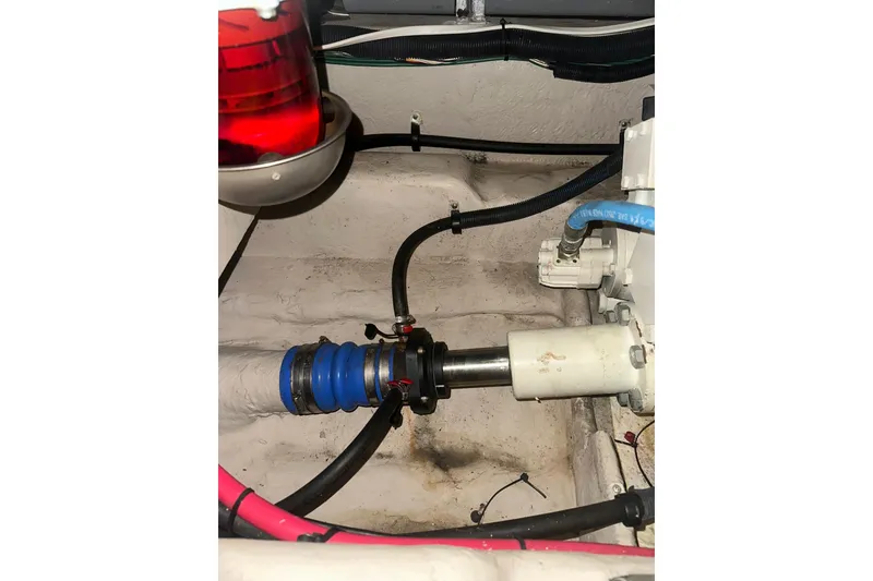 Slide: The Image of Engine compartment of 2005 Sea Ray 420 Sedan Bridge with visible mechanical components. - 18