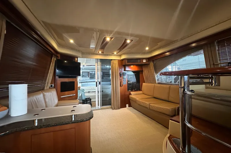 Slide: The Image of Luxurious interior of 2005 Sea Ray 420 Sedan Bridge yacht with modern amenities. - 5