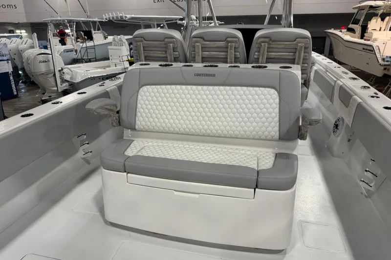 Slide: The Image of 2026 Contender 39 ST boat interior with cushioned seating and modern design. - 13