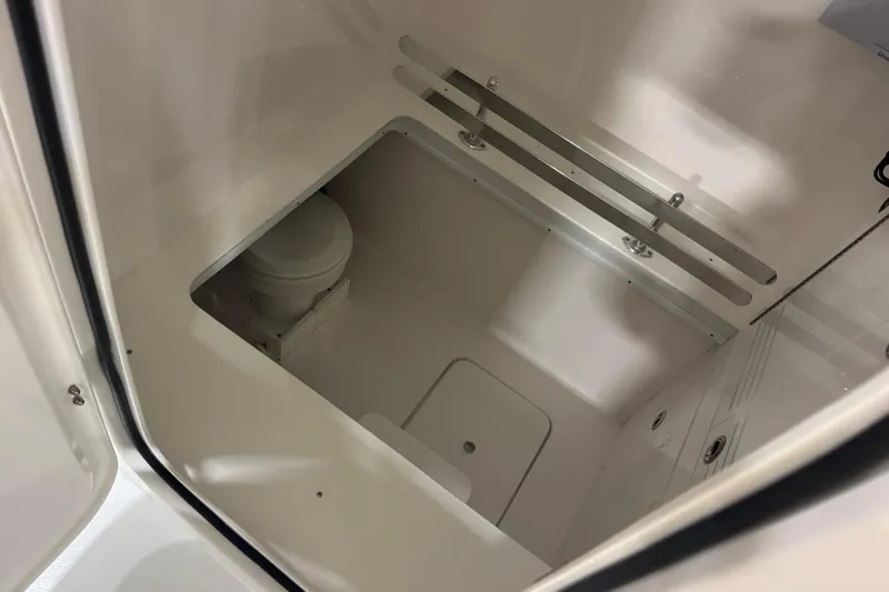 Slide: The Image of Interior view of 2026 Contender 39 ST boat's compact bathroom area. - 17