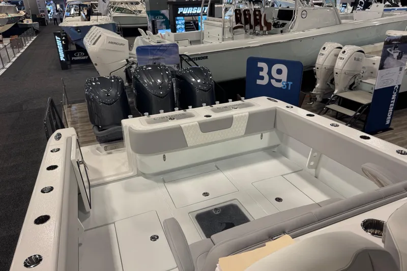 Slide: The Image of 2026 Contender 39 ST boat interior at a marine exhibition, featuring powerful Mercury engines. - 29