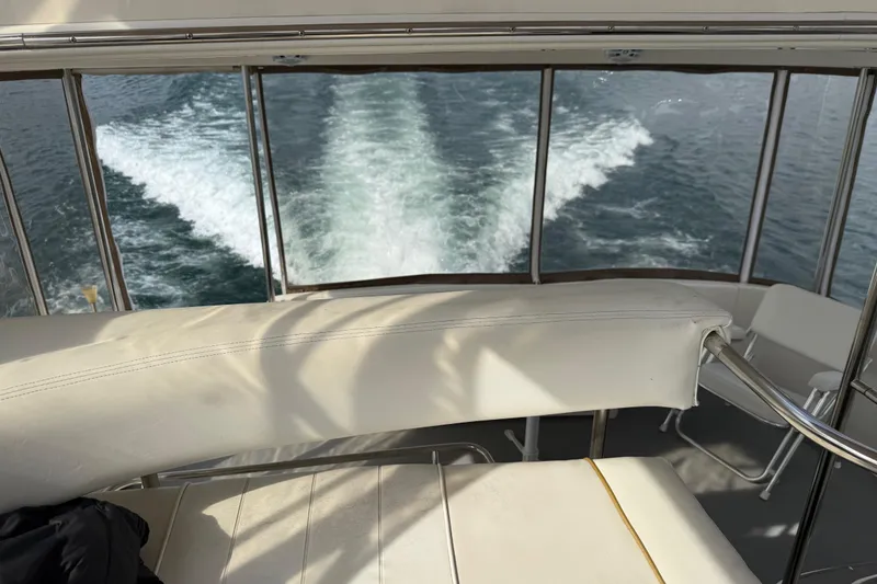 Slide: The Image of 1996 Sea Ray 420 Aft Cabin cruising, view from interior seating area. - 16