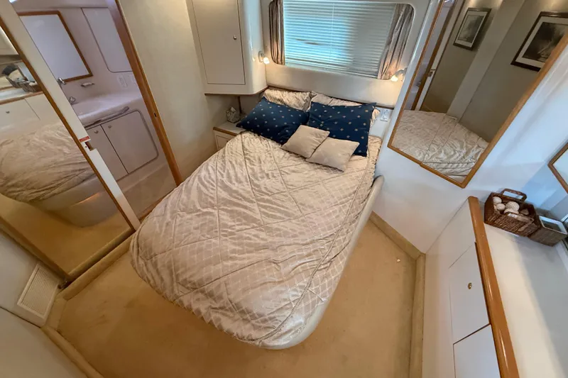 Slide: The Image of Cozy bedroom in 1996 Sea Ray 420 Aft Cabin yacht with elegant decor. - 21