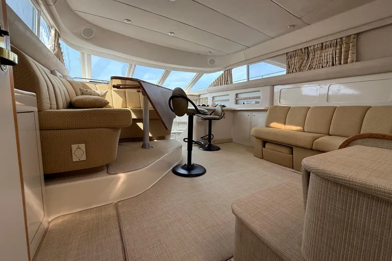 Slide: The Image of Luxurious interior of a 1996 Sea Ray 420 Aft Cabin yacht with elegant seating. - 28