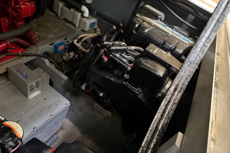 Slide: The Image of Engine room of a 1996 Sea Ray 420 Aft Cabin boat, showcasing mechanical components. - 42