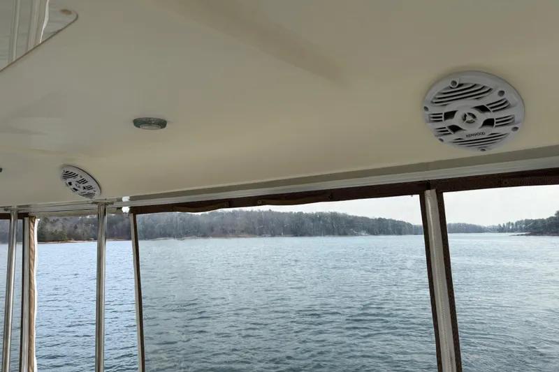 Slide: The Image of Interior view of 1996 Sea Ray 420 Aft Cabin with lake scenery. - 44