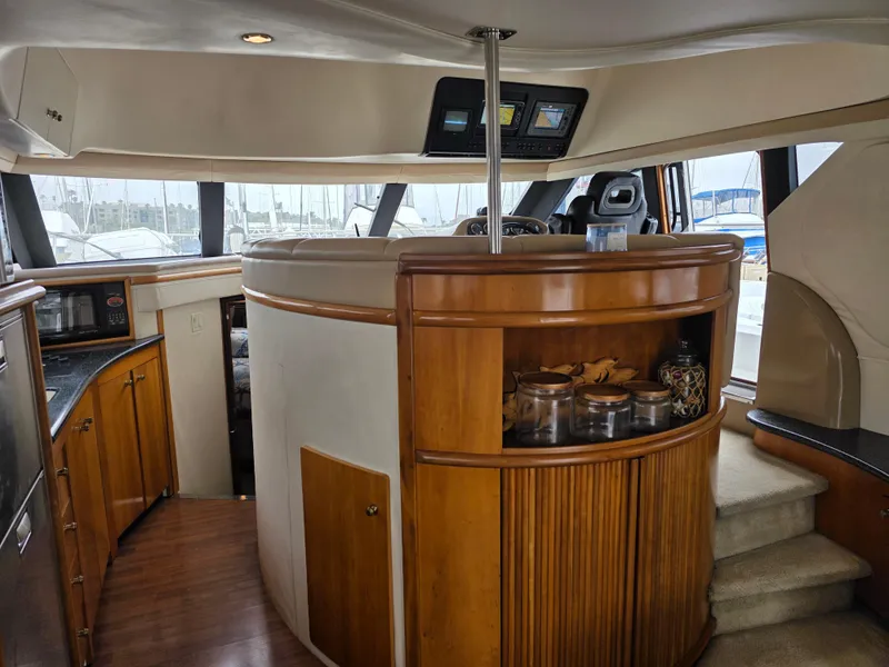 Slide: The Image of Interior of 2000 Carver 450 Voyager Pilothouse with wood cabinetry and modern amenities. - 22