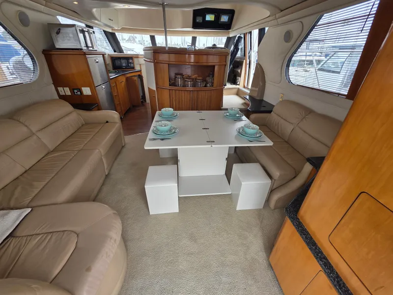 Slide: The Image of Luxurious interior of 2000 Carver 450 Voyager Pilothouse with elegant seating and dining area. - 40