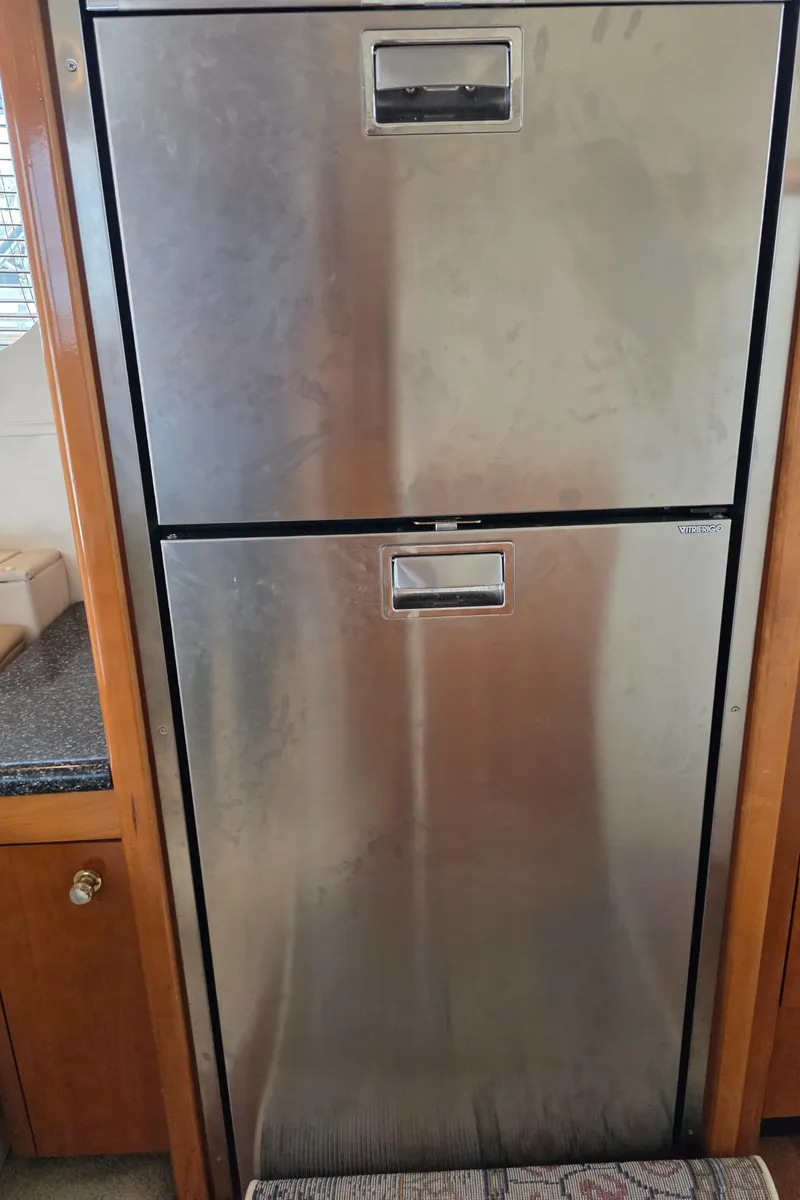 Slide: The Image of Stainless steel refrigerator in 2000 Carver 450 Voyager Pilothouse yacht interior. - 44