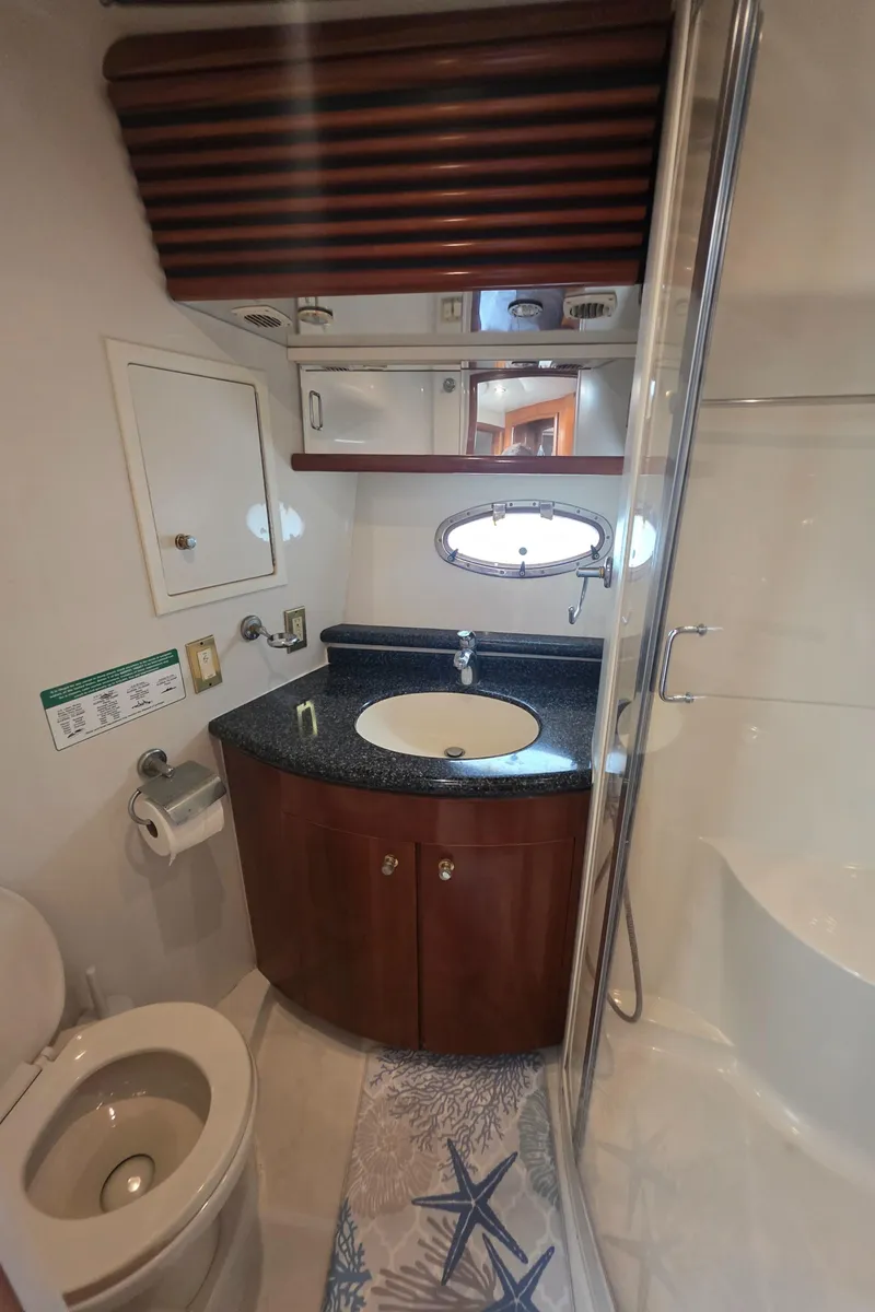 Slide: The Image of Bathroom interior of 2000 Carver 450 Voyager Pilothouse yacht with modern amenities. - 31