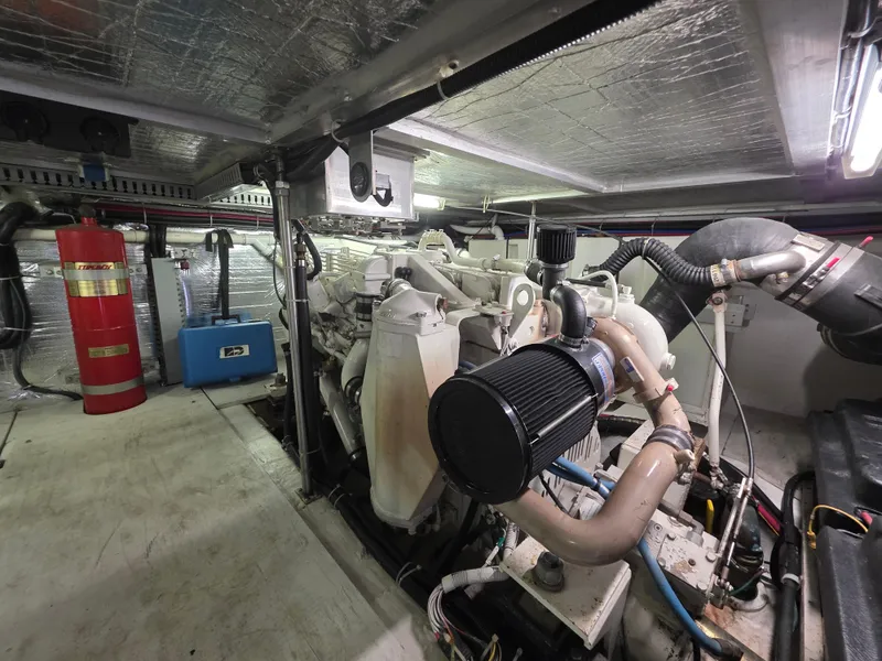 Slide: The Image of Engine room of 2000 Carver 450 Voyager Pilothouse with visible machinery and equipment. - 43