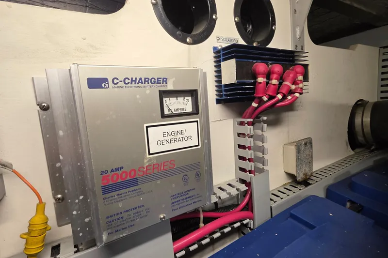 Slide: The Image of Engine room of 2000 Carver 450 Voyager Pilothouse with C-Charger and wiring. - 45