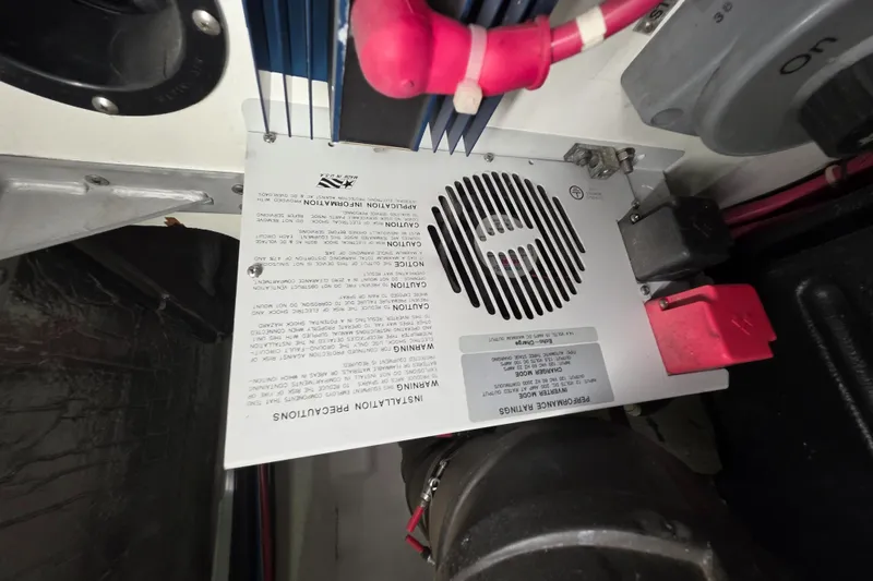 Slide: The Image of Engine compartment of 2000 Carver 450 Voyager Pilothouse with wiring and ventilation details. - 46