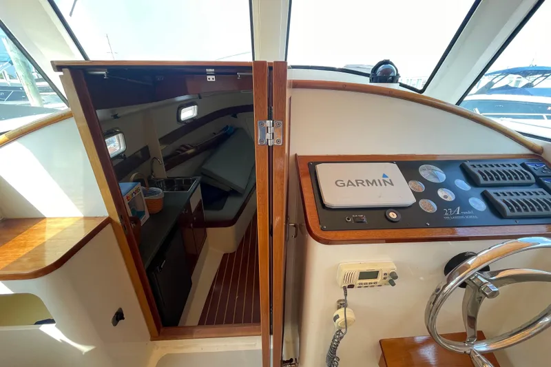 Slide: The Image of Interior view of a 2009 Landing School Arrundel 27 boat with Garmin navigation system. - 10