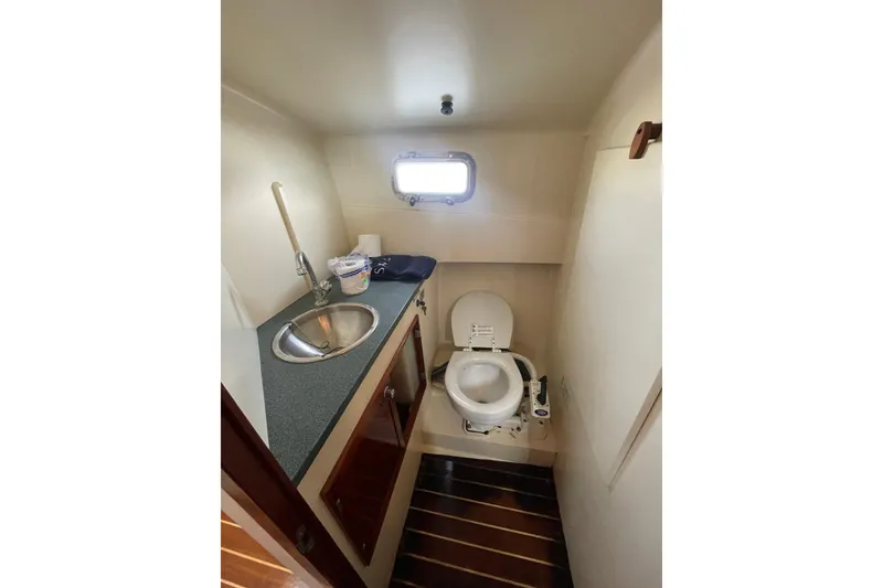 Slide: The Image of Compact bathroom in 2009 Landing School Arrundel 27 boat with sink and toilet. - 17