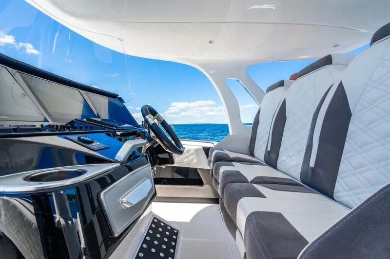 Slide: The Image of Interior of 2019 Cigarette 41' GTR boat with luxury seating and ocean view. - 14